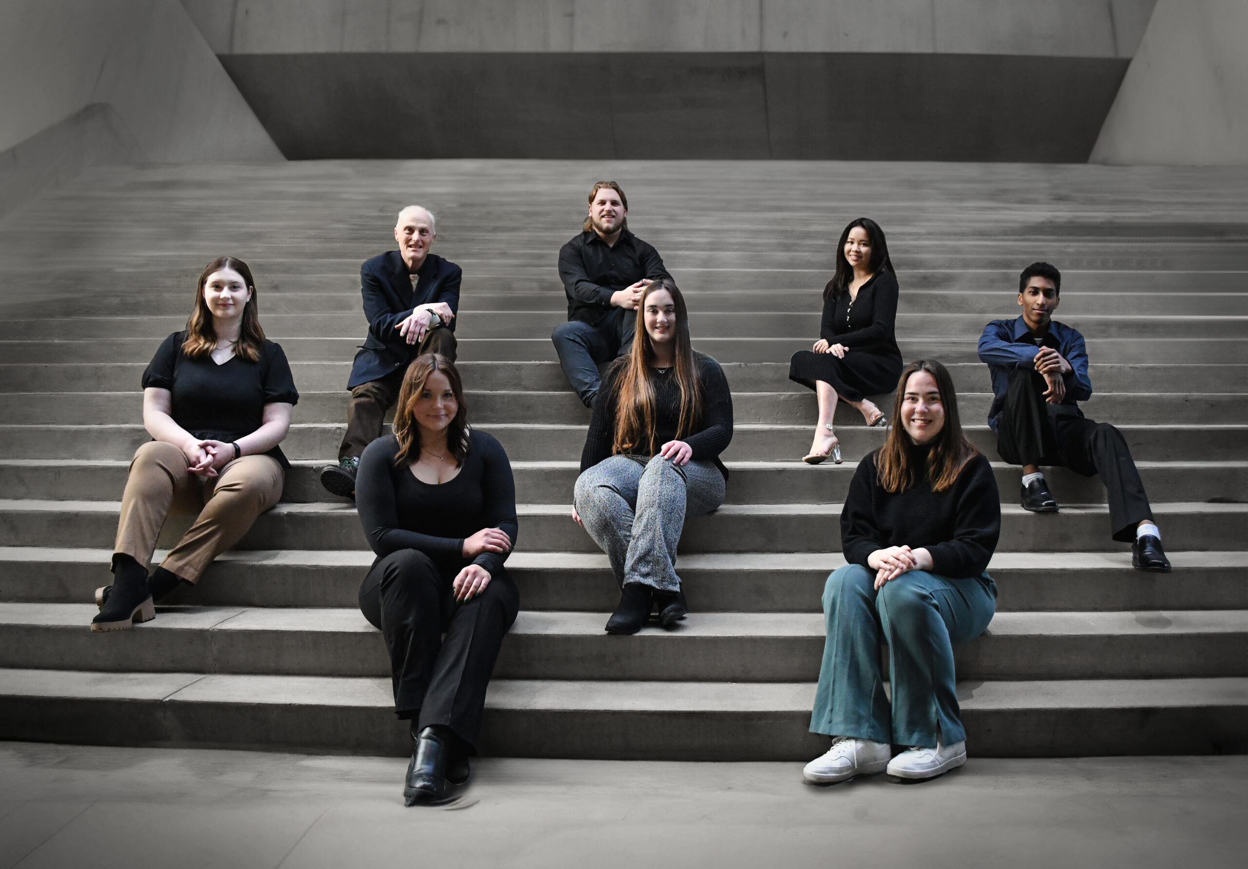 Team sitting on stairs