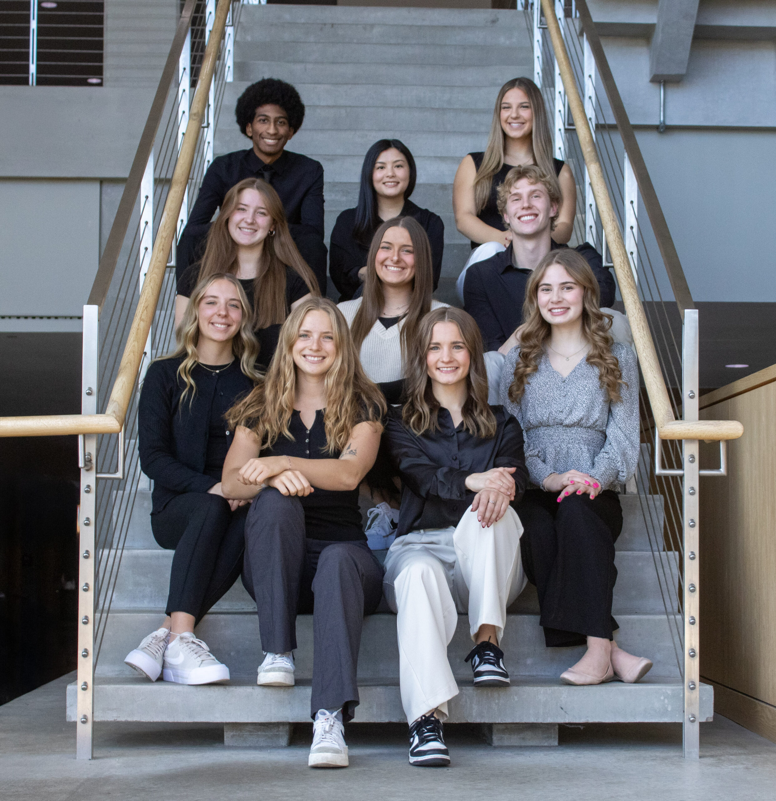 Team sitting on stairs